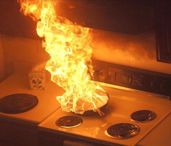 Pan on fire in a kitchen