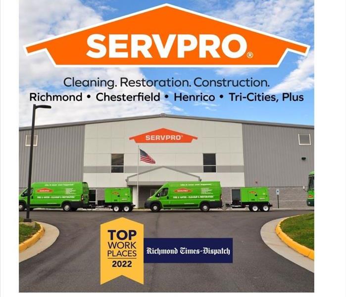 SERVPRO building with green trucks and Top Workplace logo