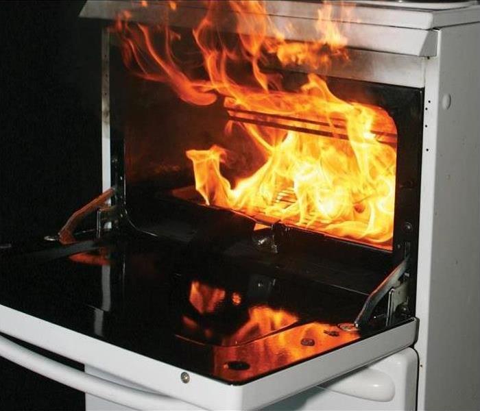flames pouring out of oven